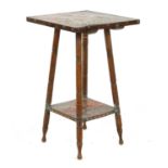 An Arts and Crafts two tier occasional table,