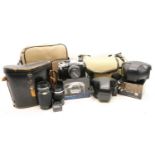 A collection of cameras and camera equipment,