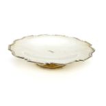A silver circular dish,