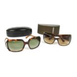 A pair of Versace sunglasses and Carolina Herrera sun glasses