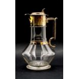 A Victorian cut glass and silver mounted claret jug,