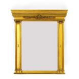 A large rococo style gilt framed mirror,