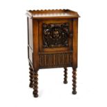 A carved walnut commode cabinet,