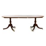 A twin pillar walnut D end dining table by David Coleman