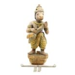 A carved and painted wooden figure of an Indian deity with horse's head and holding an instrument,