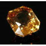 An unmounted hessonite garnet,