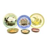 A collection of modern Moorcroft plates and coasters,