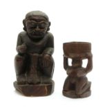 An Indonesian carved hardwood seated figure,