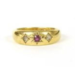 An 18ct gold ruby and diamond three stone gypsy ring,