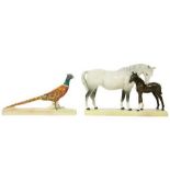 A Beswick grey mare and foal