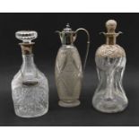Two silver mounted glass decanters,