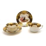 A pair of tea cups and saucers,