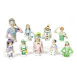 Nineteen china pin cushion dolls,