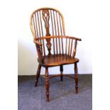 A mid 19th century and yew Windsor armchair,