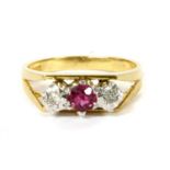 A gold ruby and diamond three stone ring,