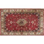 A Persian style rug,