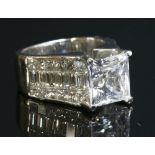 A white gold single stone white sapphire ring,
