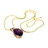 A 14ct gold amethyst and diamond pendant,