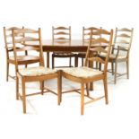 An Ercol elm dining table,