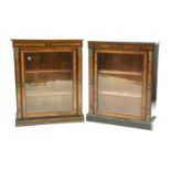 A pair of Victorian walnut and ebonised pier cabinets