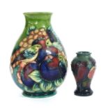 A Moorcroft tubelined decorated 'Finches & Fruit' pattern baluster vase,