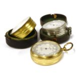 Three pocket barometer/altimeters,