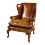 A leather wing back armchair,