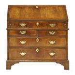 A Queen Anne figured walnut bureau