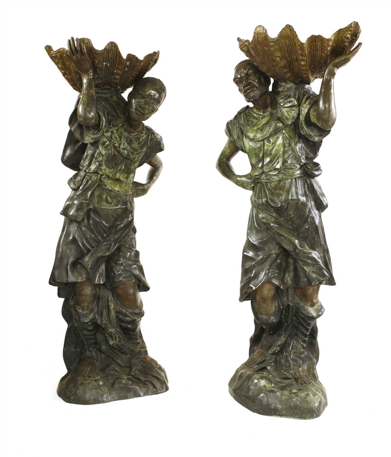 A pair of life-sized green patinated bronze blackamoors,