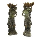 A pair of life-sized green patinated bronze blackamoors,