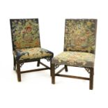 A pair of Chippendale period single library chairs,