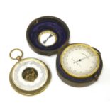 Two pocket barometer altimeters,