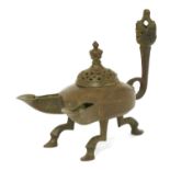 A Persian bronze double-spouted oil lamp,