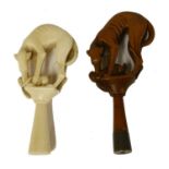 A carved ivory pipe tamper,