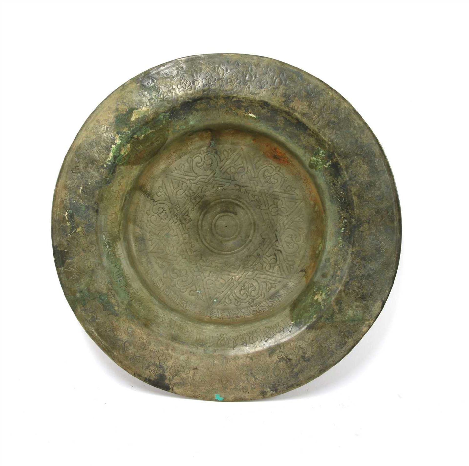 A Persian engraved bronze serving dish,