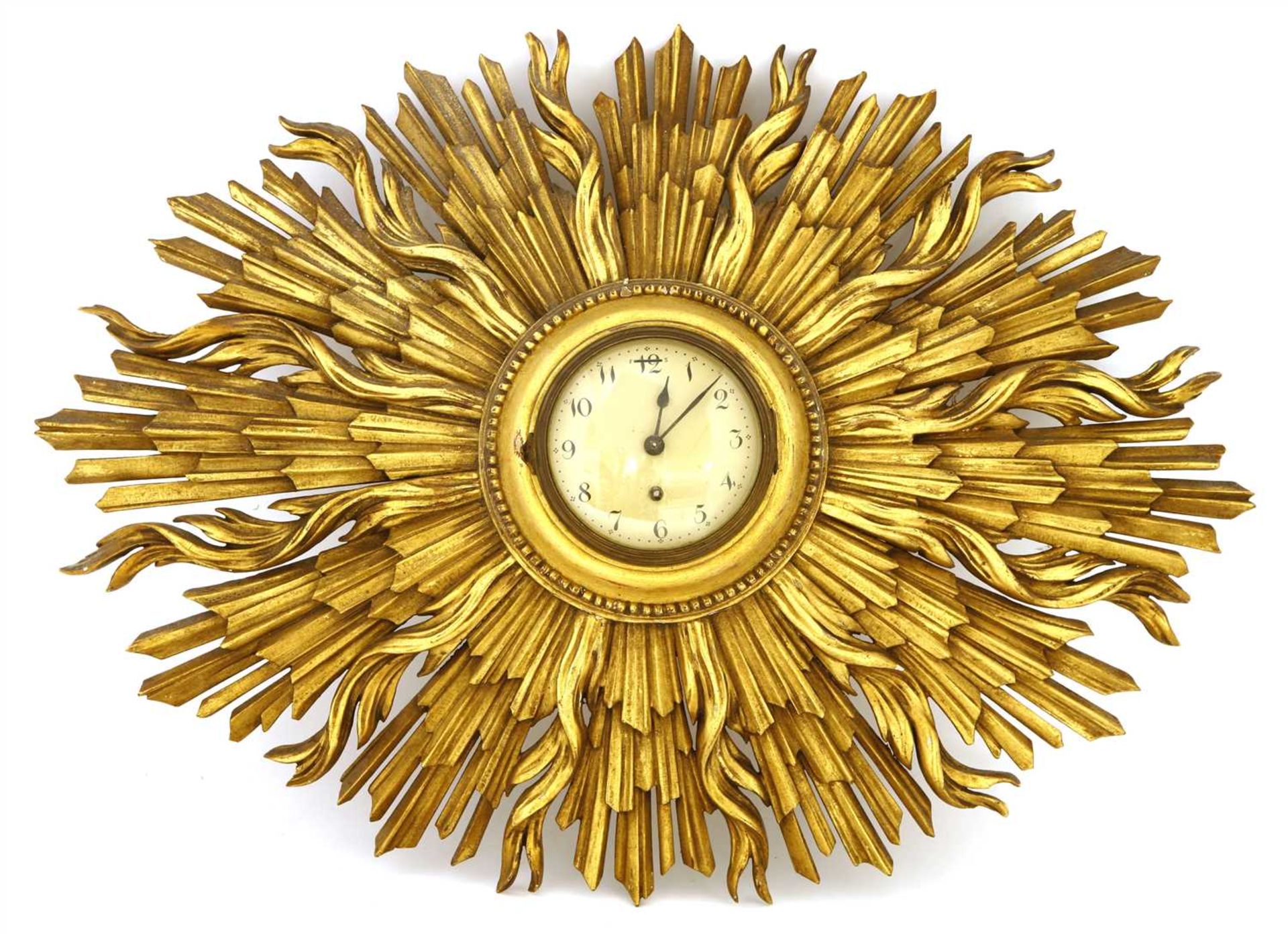 A carved and gilt sunburst wall clock,