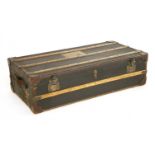 A leather and canvas bound travelling trunk,