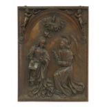 A relief carved panel of The Annunciation,