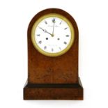 A French amboyna mantel clock,