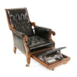 A William IV mahogany and studded leather reclining library armchair,
