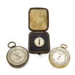 Three pocket barometers/altimeters and silver fob,