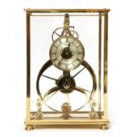 A polished brass skeleton clock,