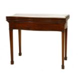 A George III mahogany serpentine-fronted triple fold-over tea and card table,