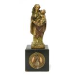 An early carved wood figure of the Madonna and Child,