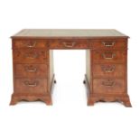 A burr elm twin pedestal desk,