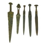 Five bronze daggers,