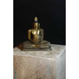 A gilt bronze figure of a seated Buddha,