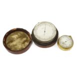 A silver-plated barometer/altimeter,