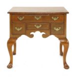 A George II-style walnut lowboy,