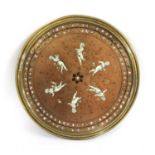 A circular copper plaque,